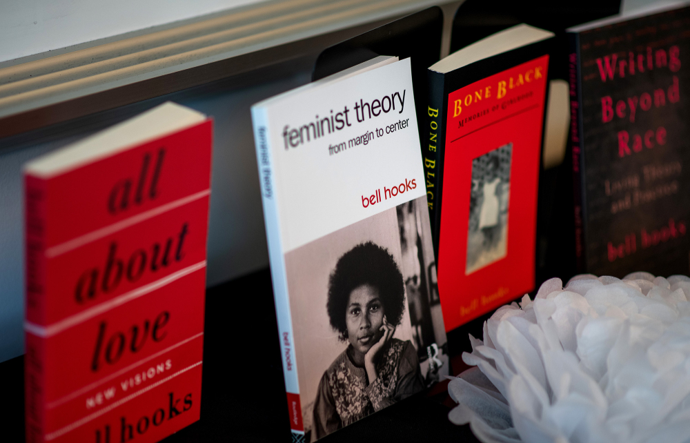 books lined up on display, all written by bell hooks