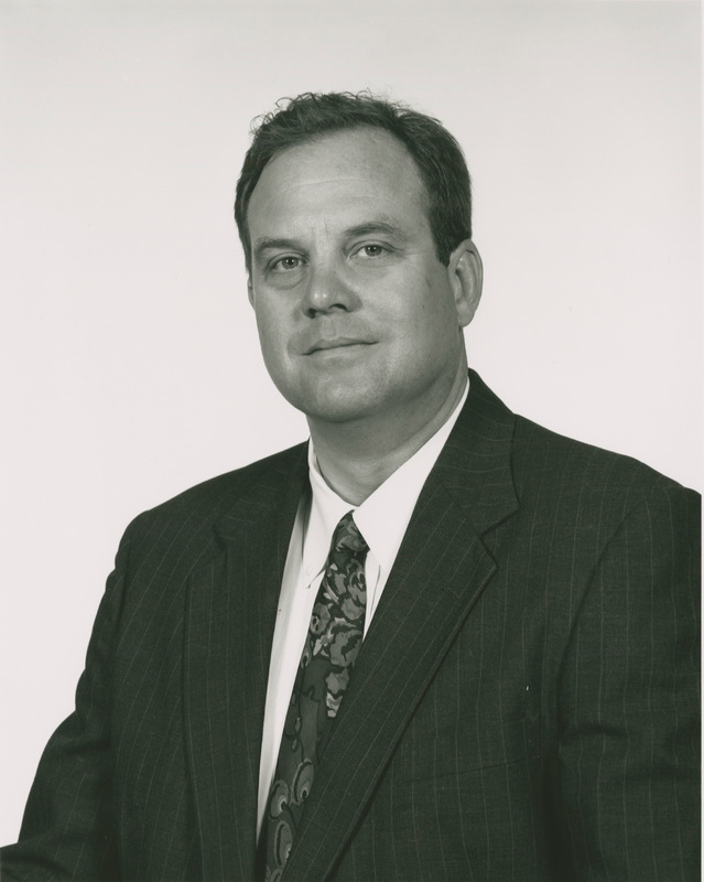 Frank Griggs in dark suit, black and white photo