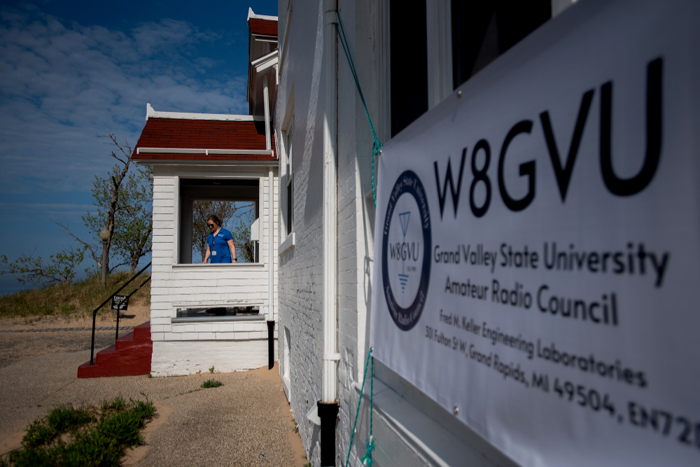 sign outside bottom of lighthouse for W8GVU amateur radio council