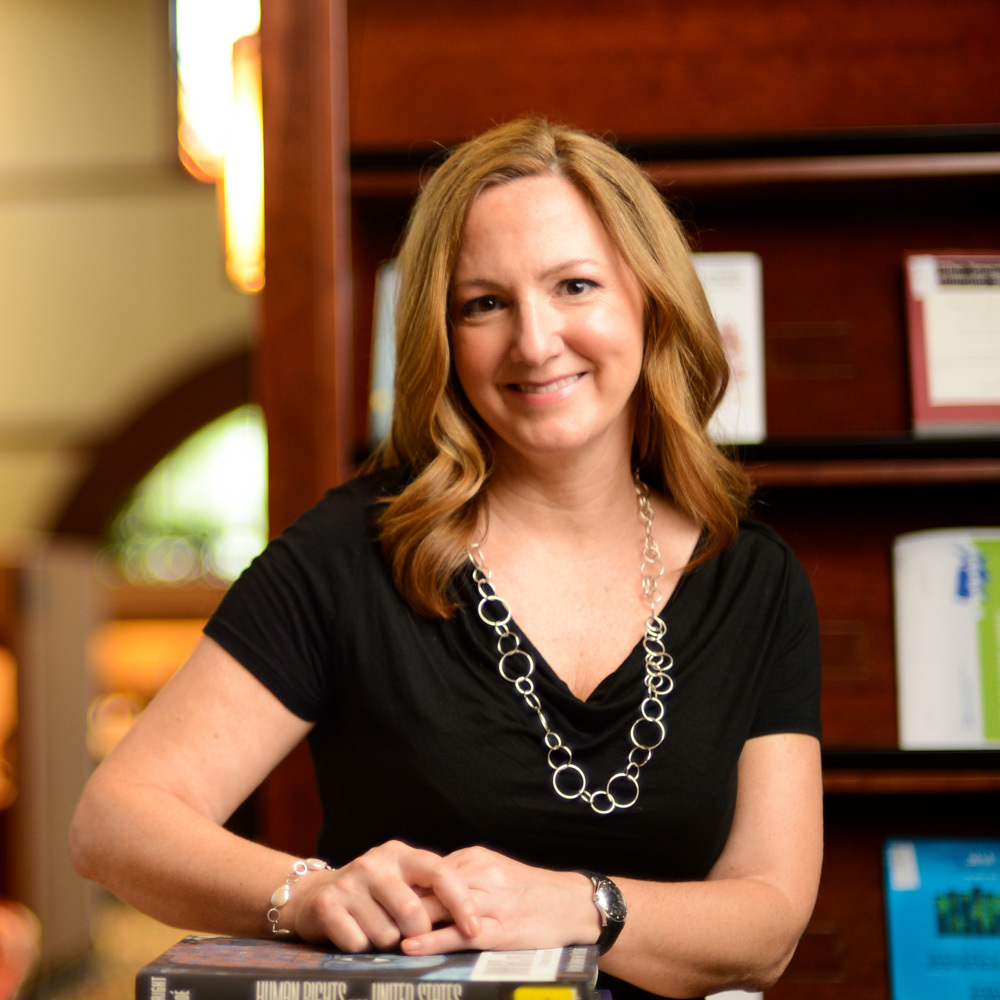 portrait of Barbara Goodspeed, standing in office suite