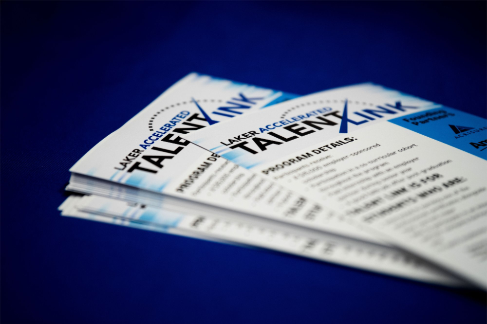 Laker Accelerated Talent Link flyers on a table fanned out