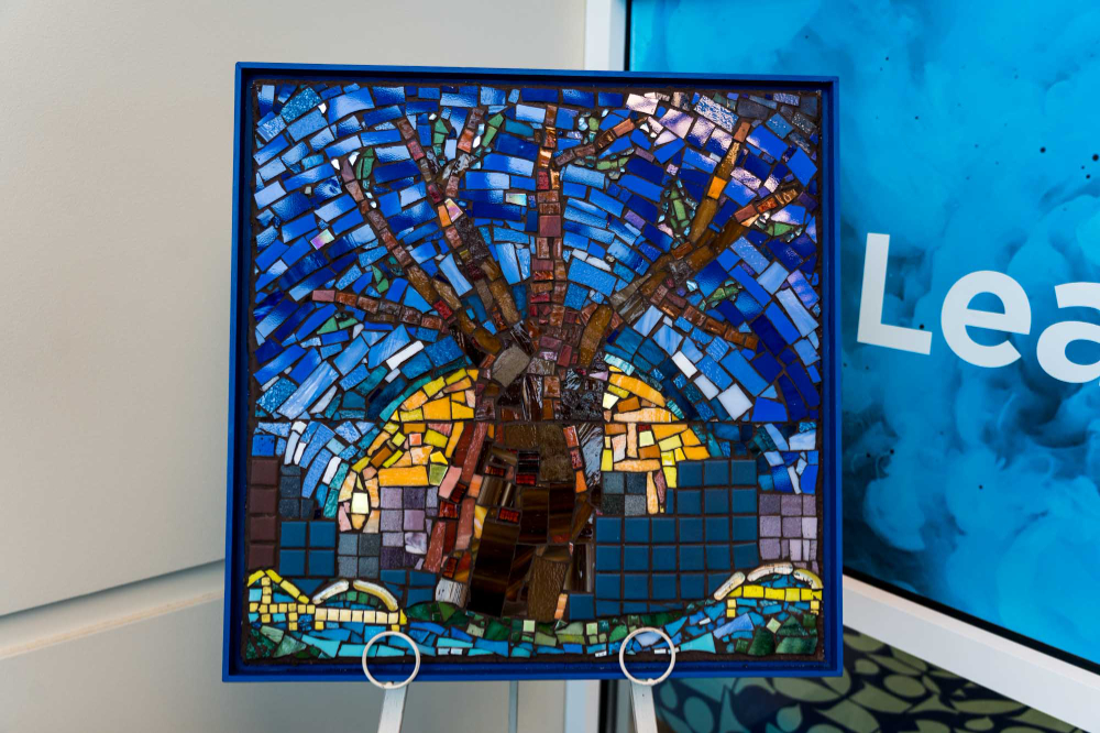 square mosaic of three against background of deep blues