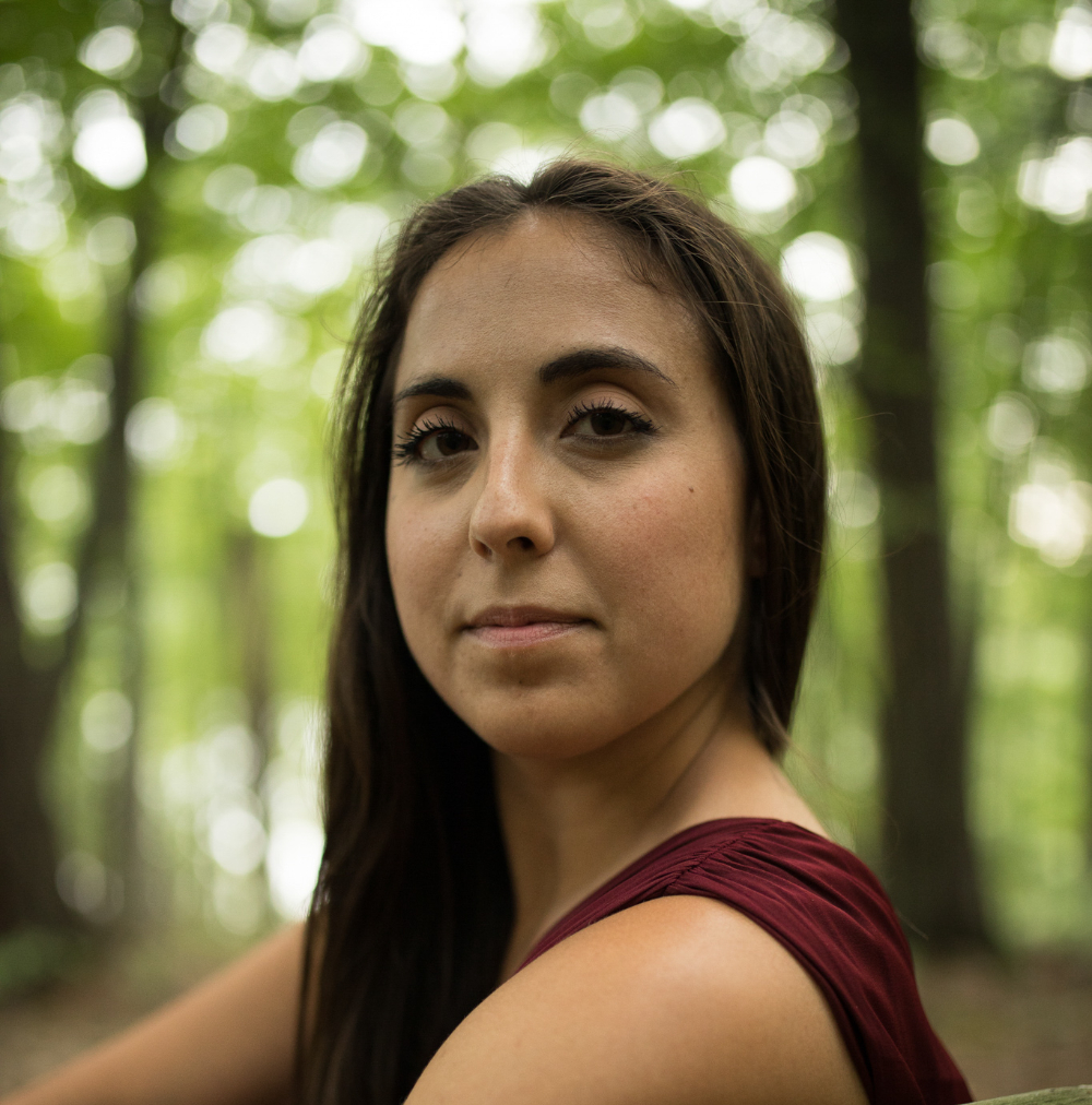 headshot of Ari Mokdad, taken outside with out of focus trees in the background