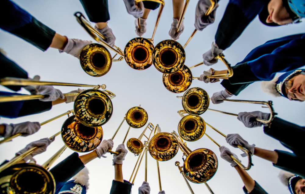 section of trombones taken from ground looking up at instruments