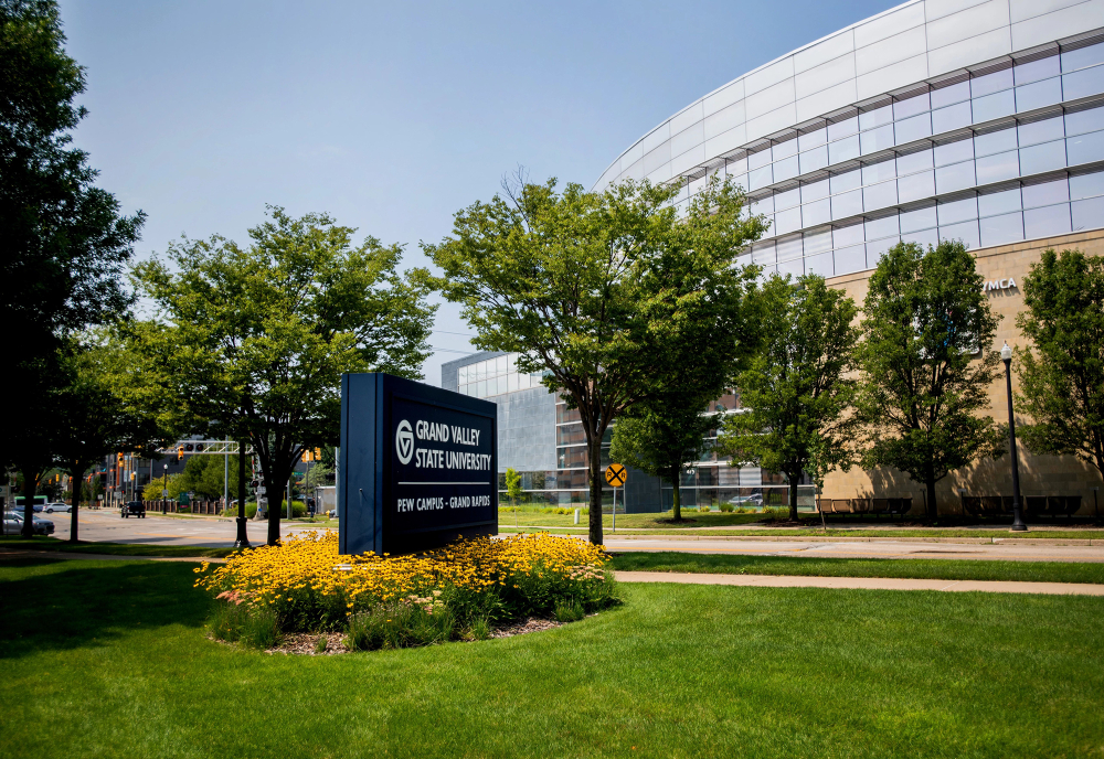 The David D. Hunting branch of the YMCA of Greater Grand Rapids is shown in the background across the street from the Pew Grand Rapids campus blue signage