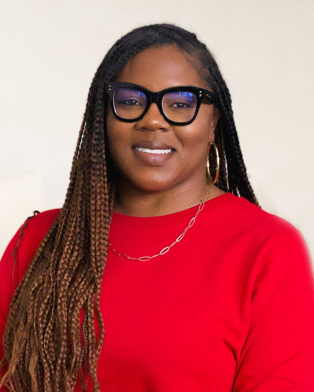 Khalilah Burt Gaston in red shirt with glasses