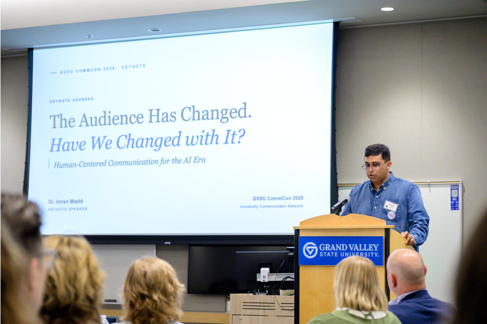 Imran Mazid at a podium, at his right is a screen with The Audience Has Changed. Have We Changed with It?
