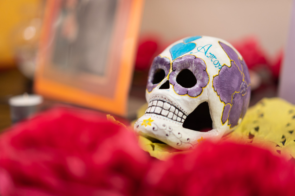 a decorative skull adorns an alter during a D&iacute;a de los Muertos event