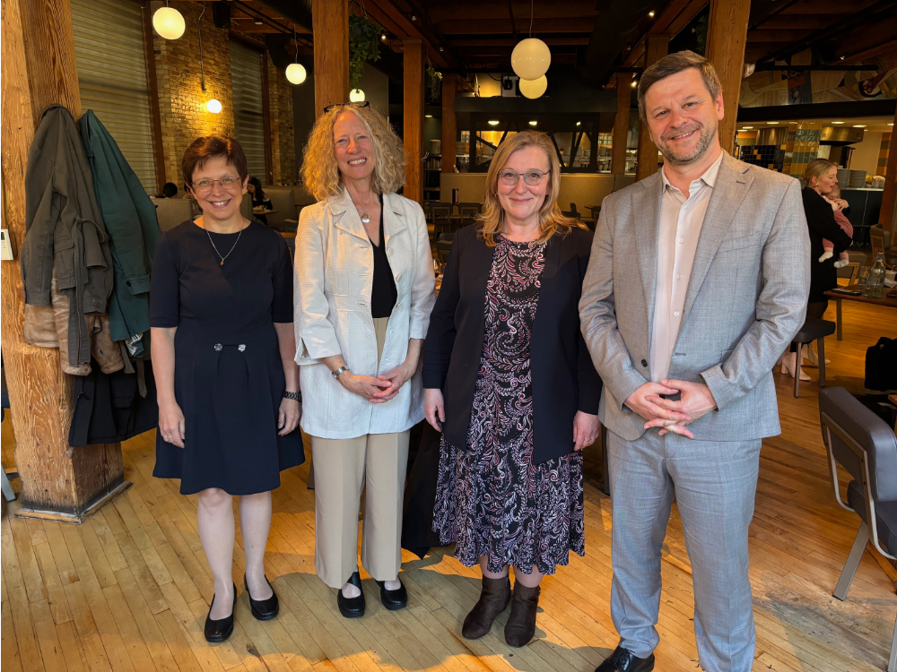 From left to right are Renata Tom&aacute;&scaron;kov&aacute;, Jennifer Drake, Marlen Vavrikov&aacute; and Petr Kopeck&yacute;, all standing in a restaurant