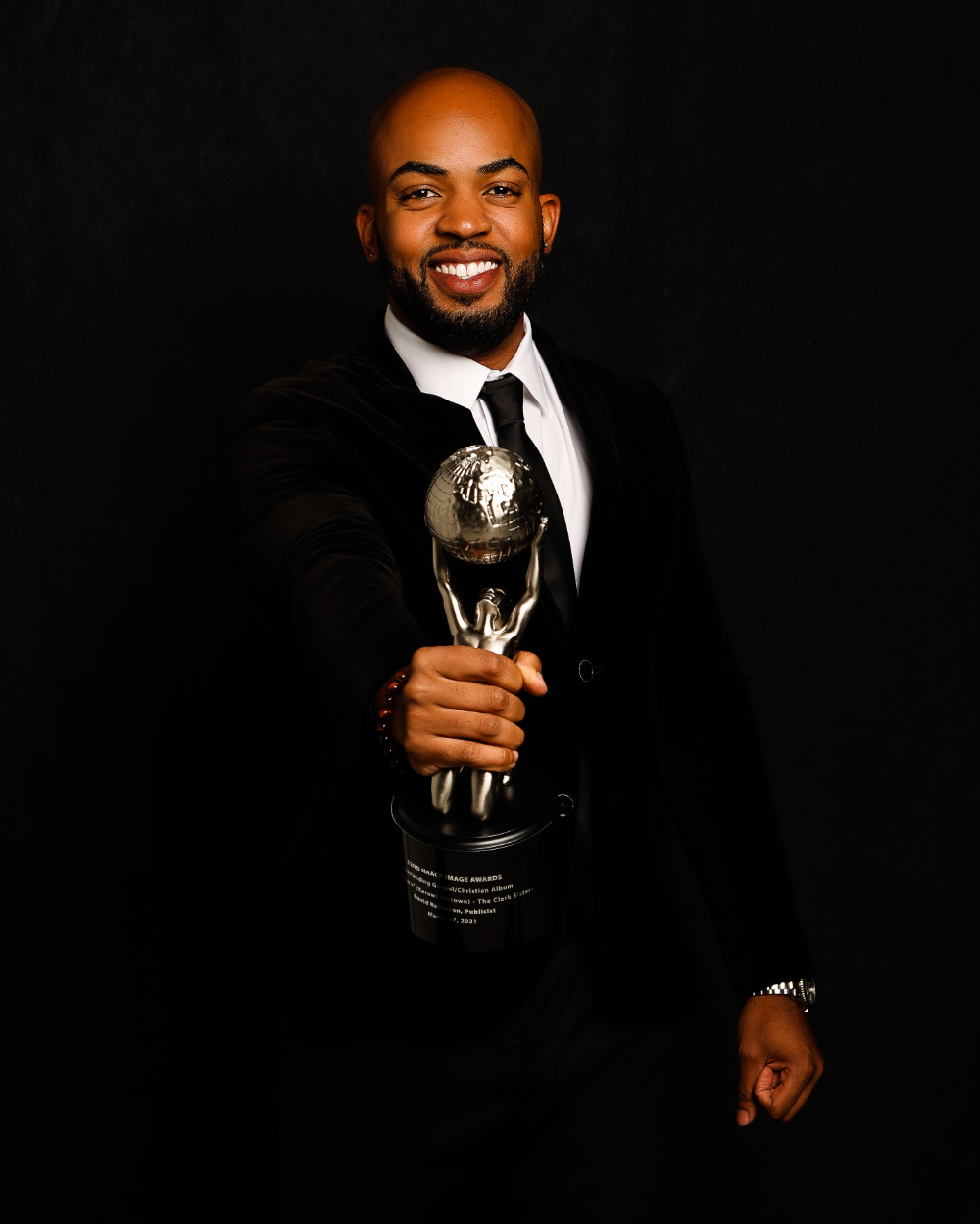 David Robinson holds a silver trophy