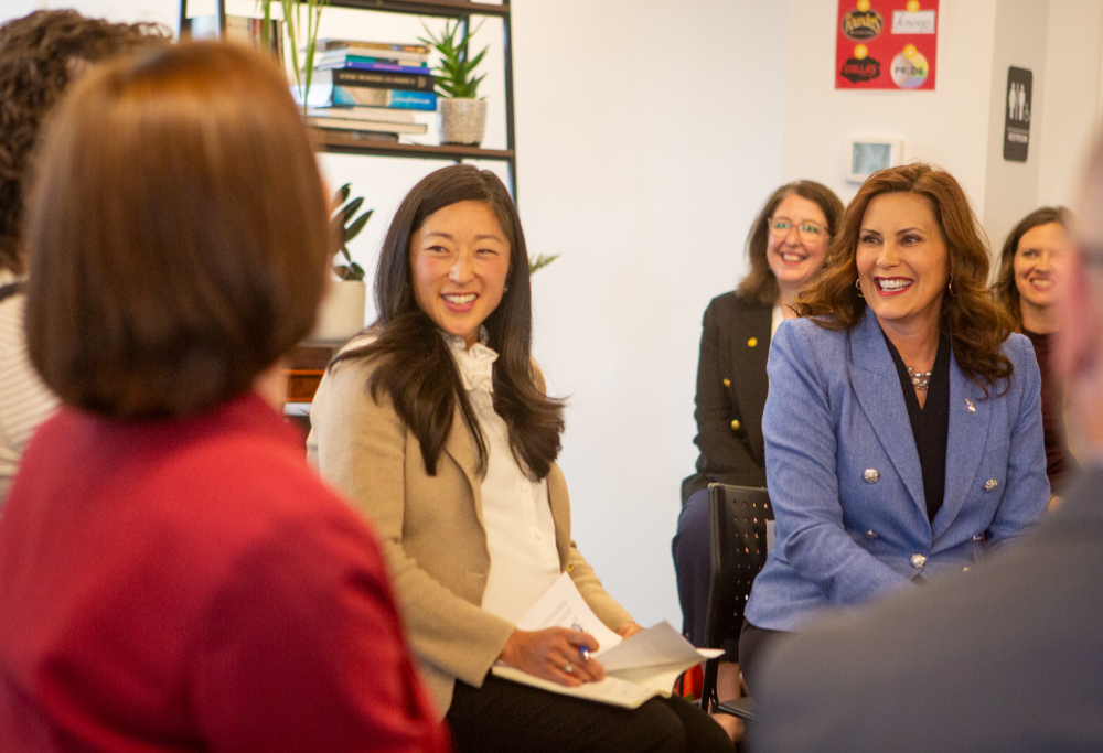 people in chairs seated in a circle, Gov. Whitmer at far right