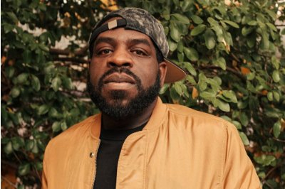 headshot, taken outside in front of trees, of Hanif Abdurraqib