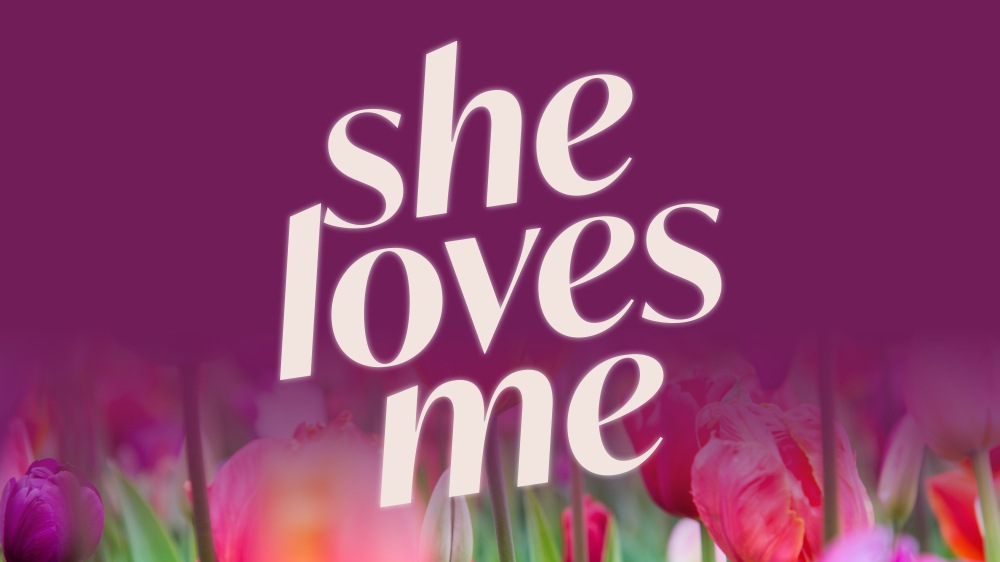 graphic she loves me, with flowers on bottom maroon background