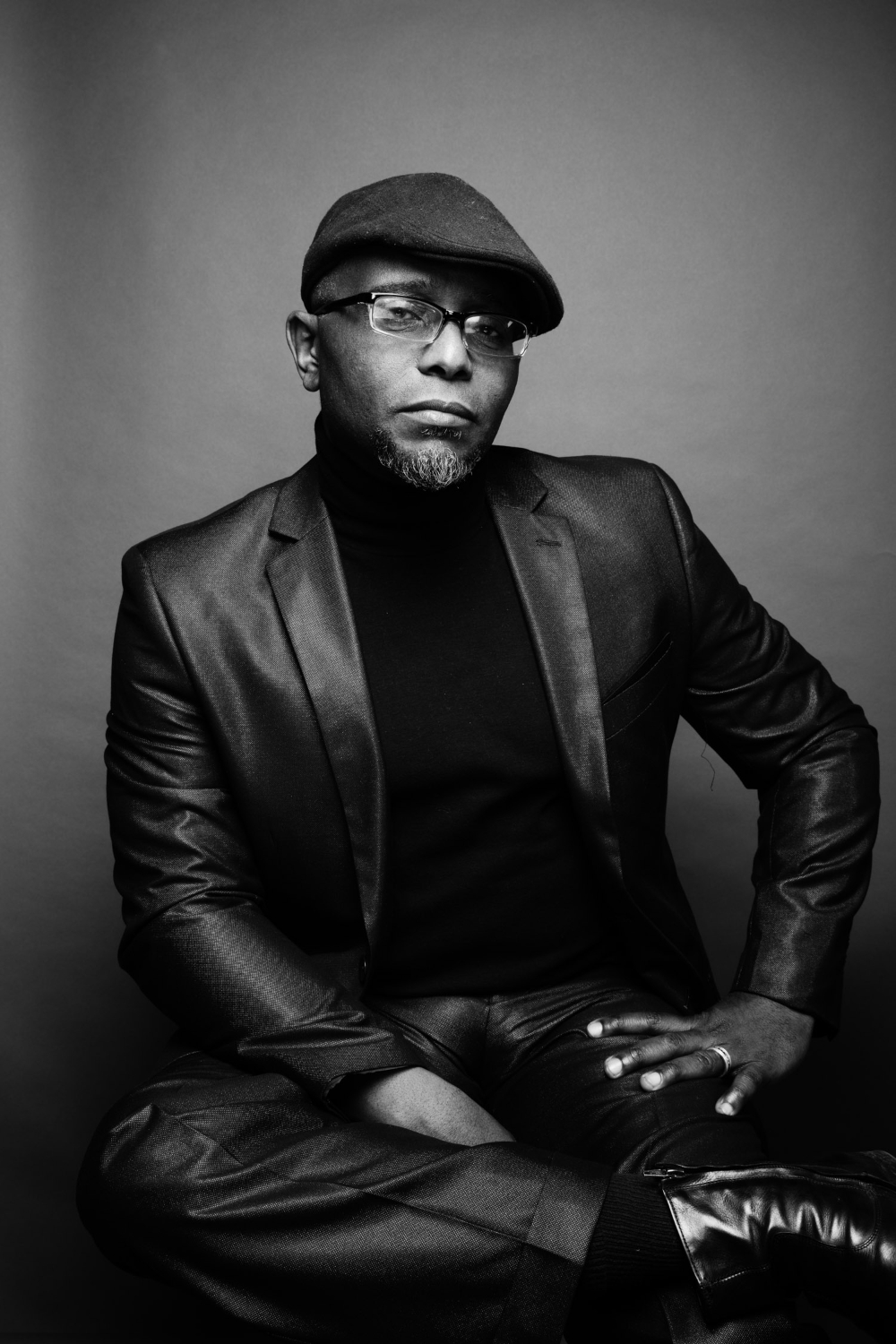 Tyehimba Jess in black leather jacket and hat