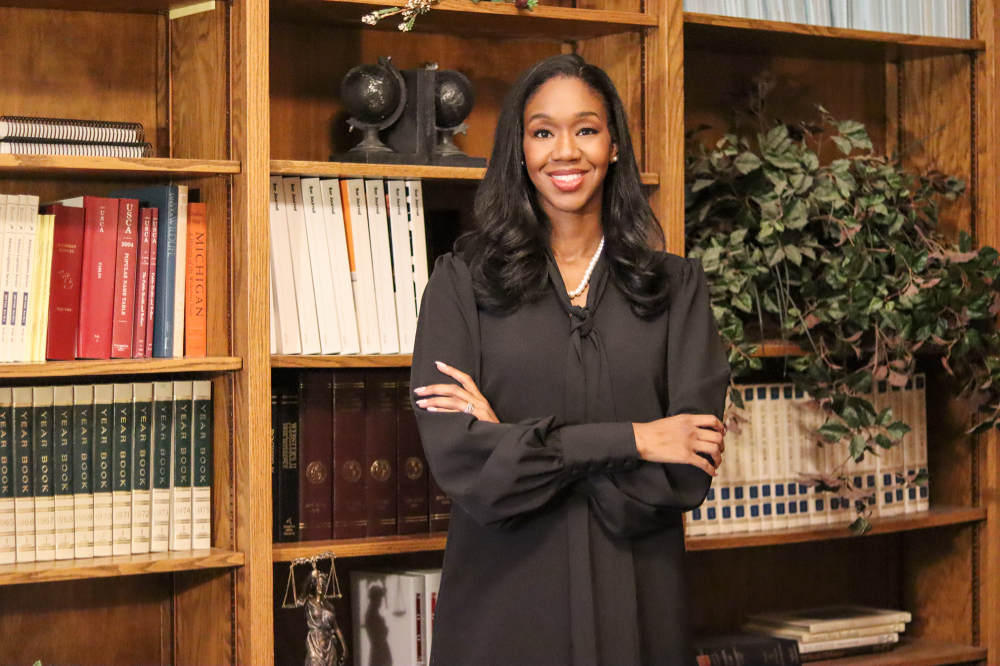 Justice Kyra Harris Bolden stands in front of a bookcase