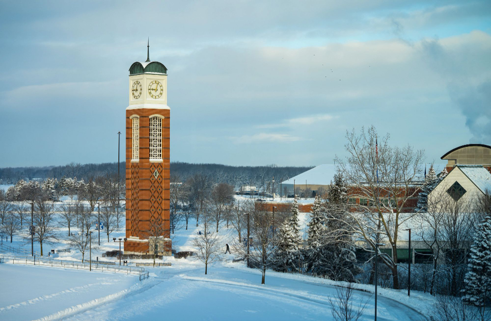 winter on Allendale Campus, clock tower in center, Student Services building to right