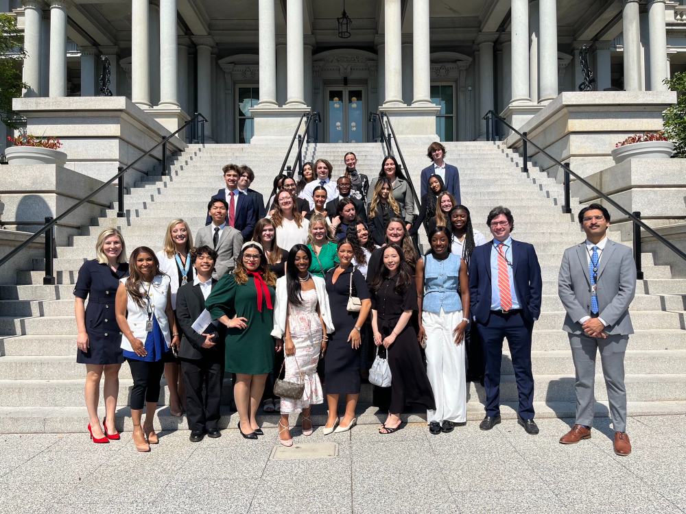 large group standing on steps in front of a building in Washington, D.C.