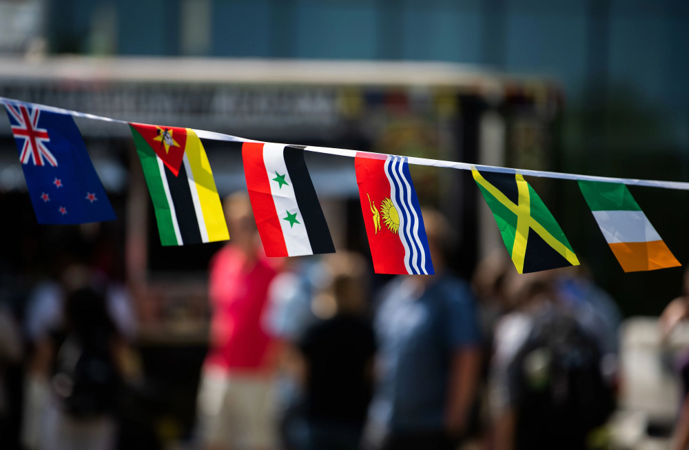 small country flags hung on clothesline