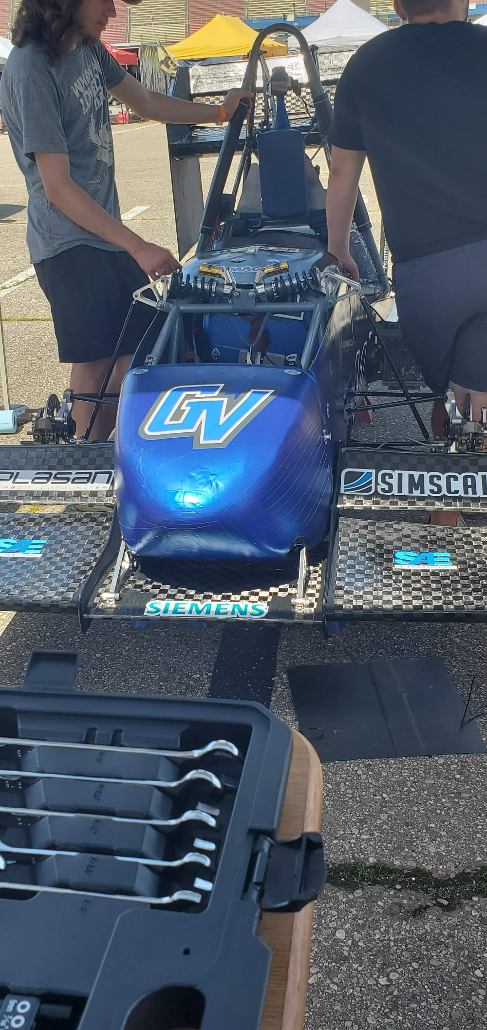 close up of mini formula one car with GV logo and other business sponsor logos pictured