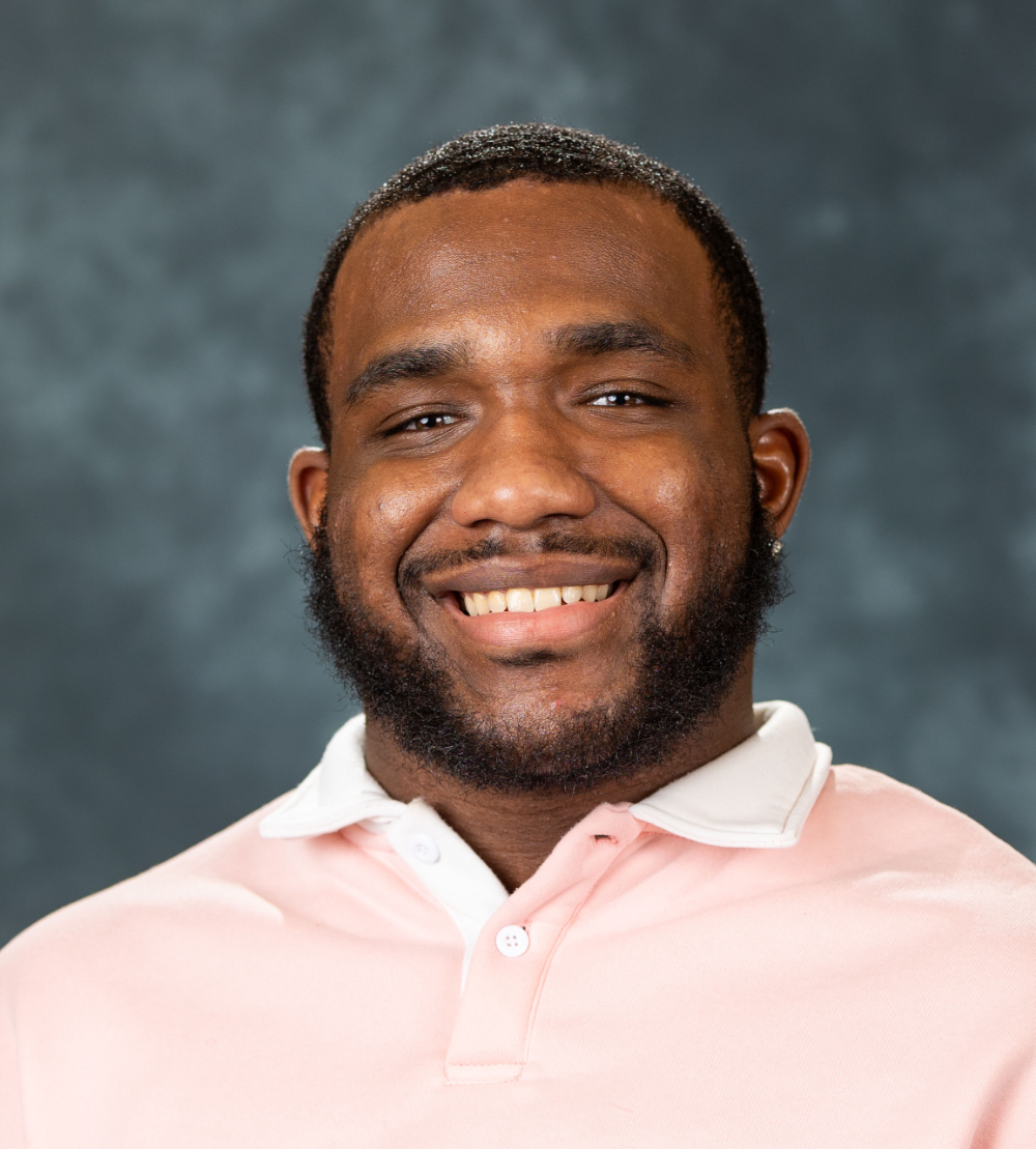Kaijehl Williams in pink shirt, smiling