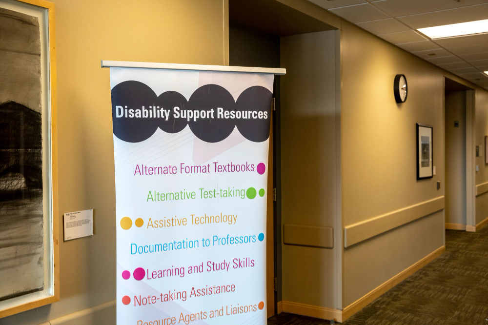 vertical banner for Disability Support Resources in hallway