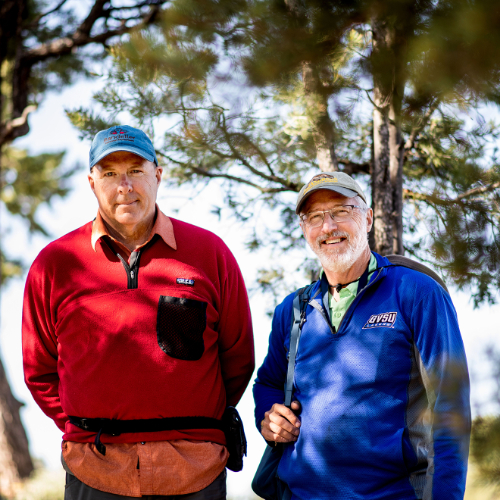 Peter Riemersma, left, and Peter Wampler in front of trees at the Grand Canyon