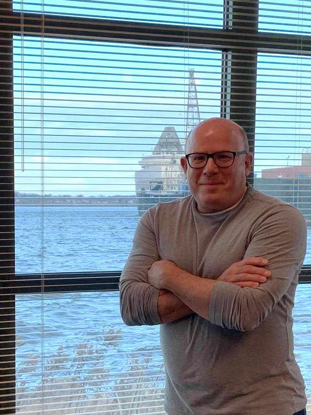 Kurt Thompson standing by a window