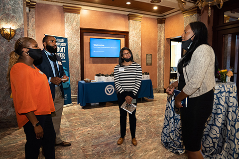 Elizabeth Russell, at right, speaks to attendees.