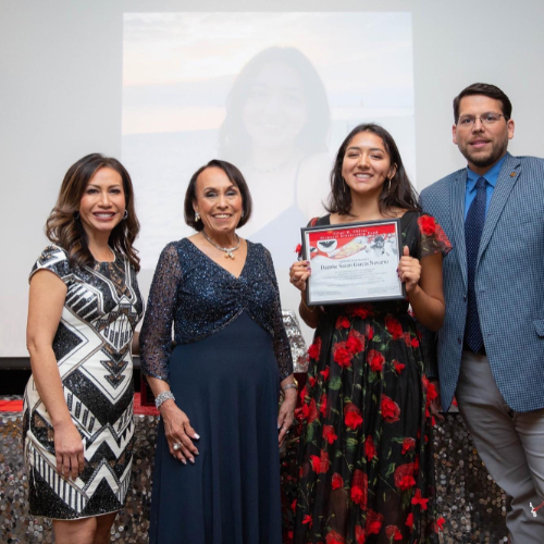 from left are Connie Dang, Lupe Ramos-Montigny, Danahe Garcia and Jesse Bernal standing in front of projection screen. Danahe holds a certificate.