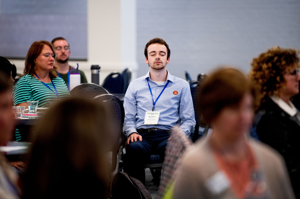 Graduate student Quinten Proctor, center, participates in a mindfulness exercise