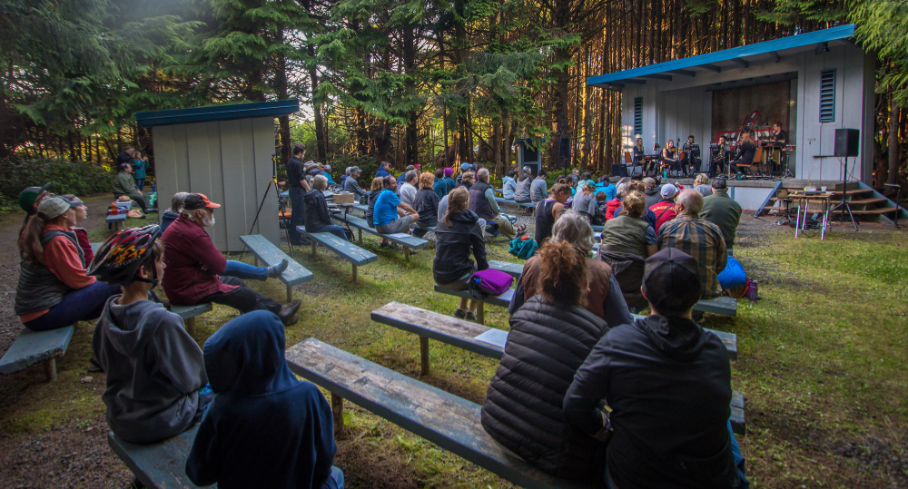 musicians perform at an outside theater space at Olympic National Park