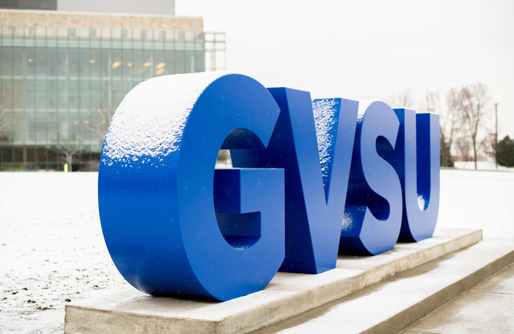 new Laker Letters spell GVSU on lawn in front of Pew Library on Allendale Campus, a light snow is on the ground