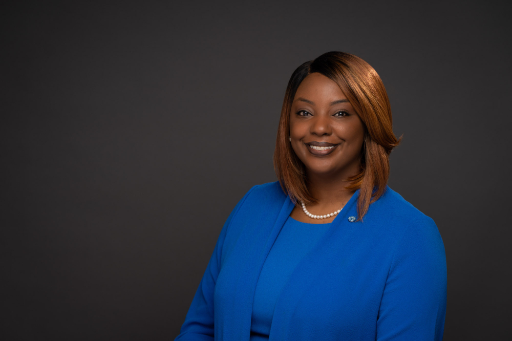 portrait of Mary McConner who is dressed in Laker blue shirt and suit jacket