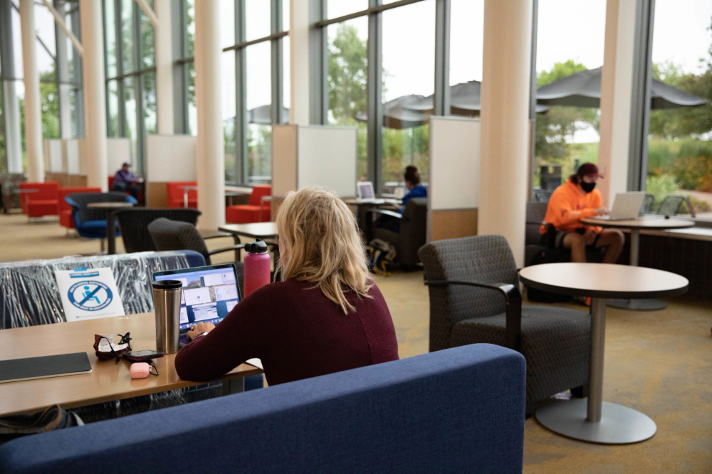 students seated at work spaces in the Mary Idema Pew Library