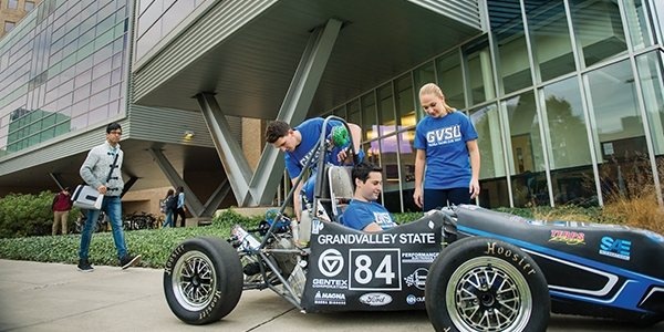 Students with Formula SAE Car.