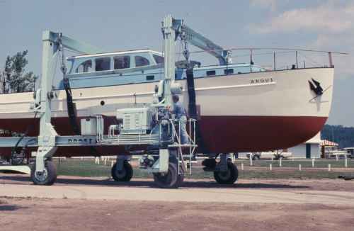 An old photo of The Angus boat on a blue lift