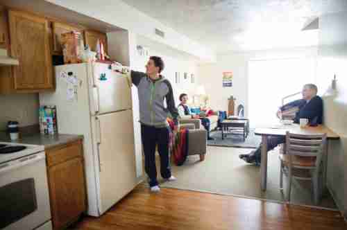 Male Students in the kitchen/living area of a Laker Village apartment