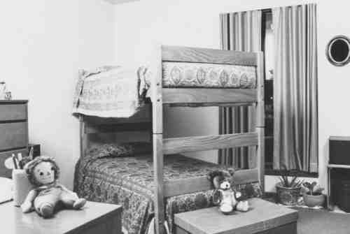 Black and white archive photo showing a bedroom in the Ravines