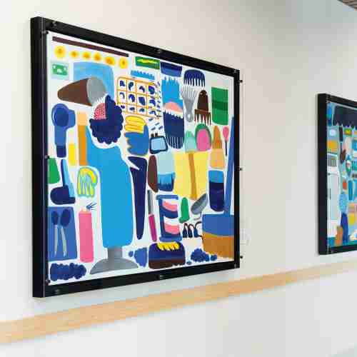 Framed colorful paintings on a wall