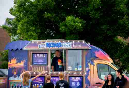 People line up at the colorful Kona Ice truck