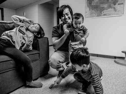 John Wen plays with his children