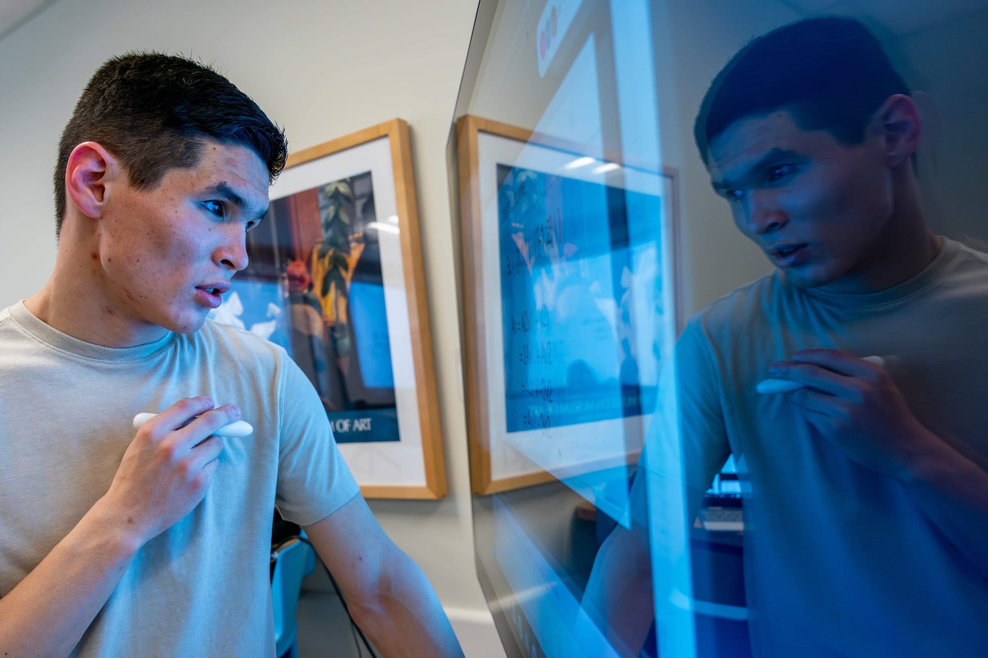 student looking closely at screen