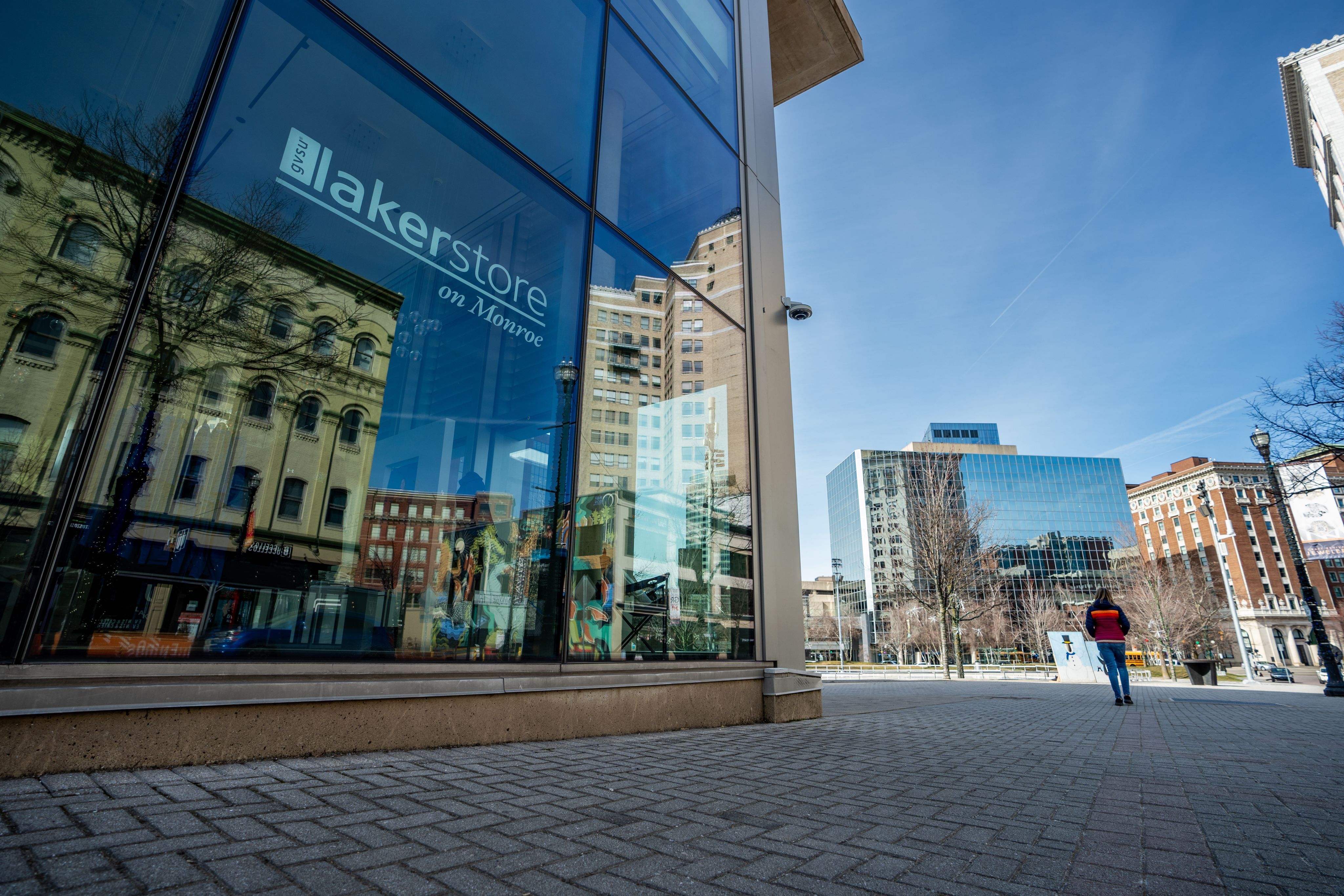 exterior of Laker Store showing glass store front and buildings downtown