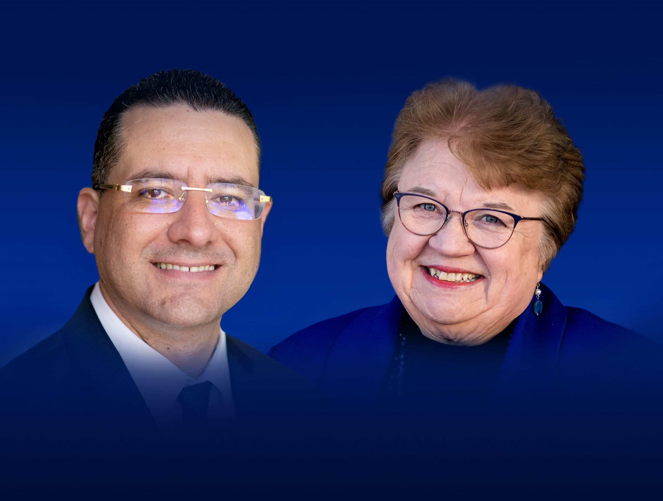 Linda Lewandowski in a blue jacket and black shirt and another dean in a suit