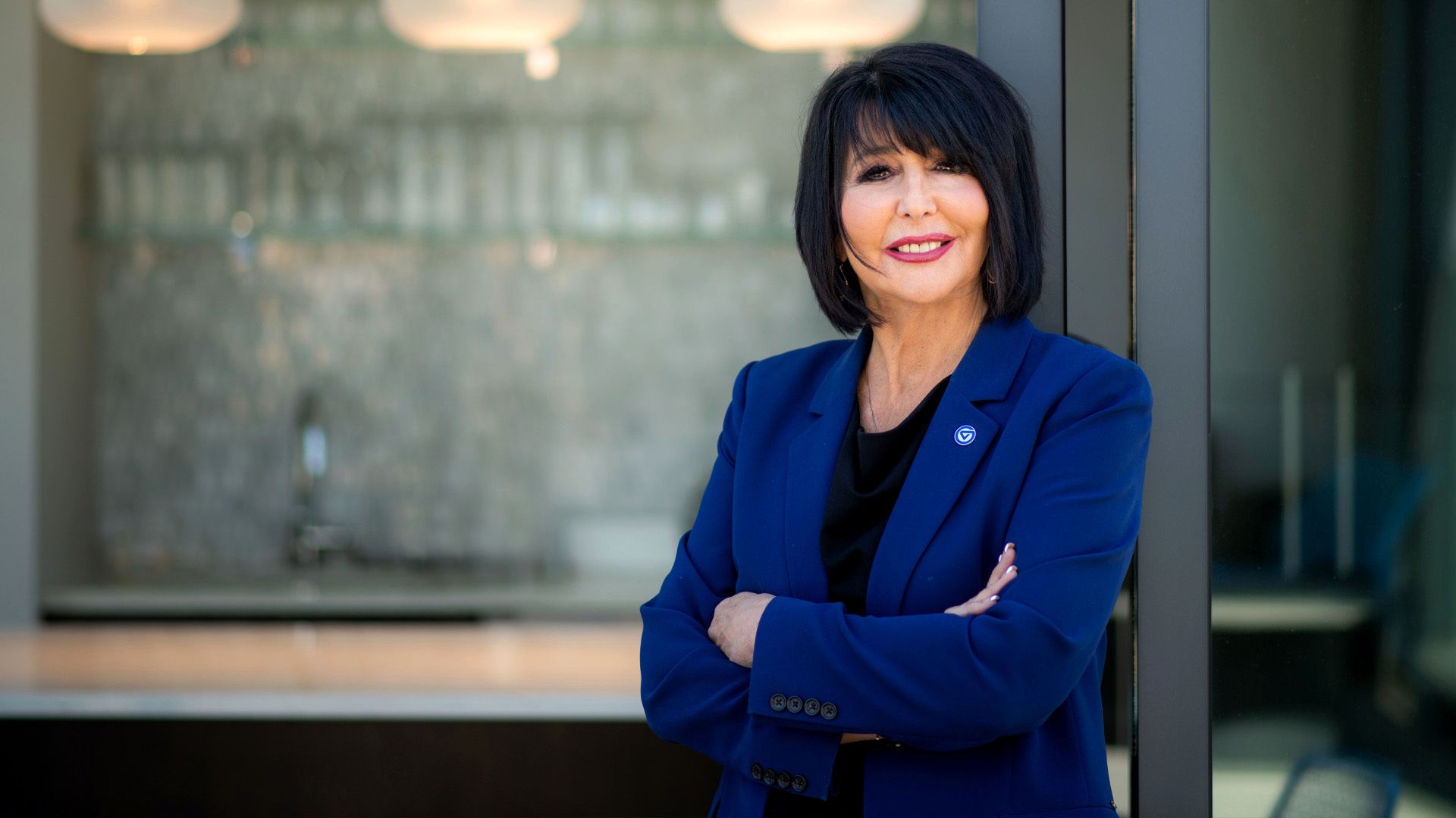 Portrait of President Mantella in a GVSU blue blazer