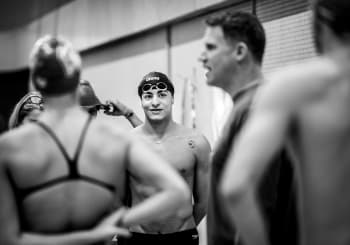 swimmers on the pool deck before a practice