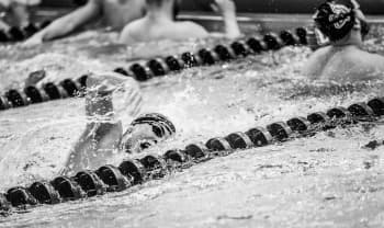 swimmer in a race swimming within the lane