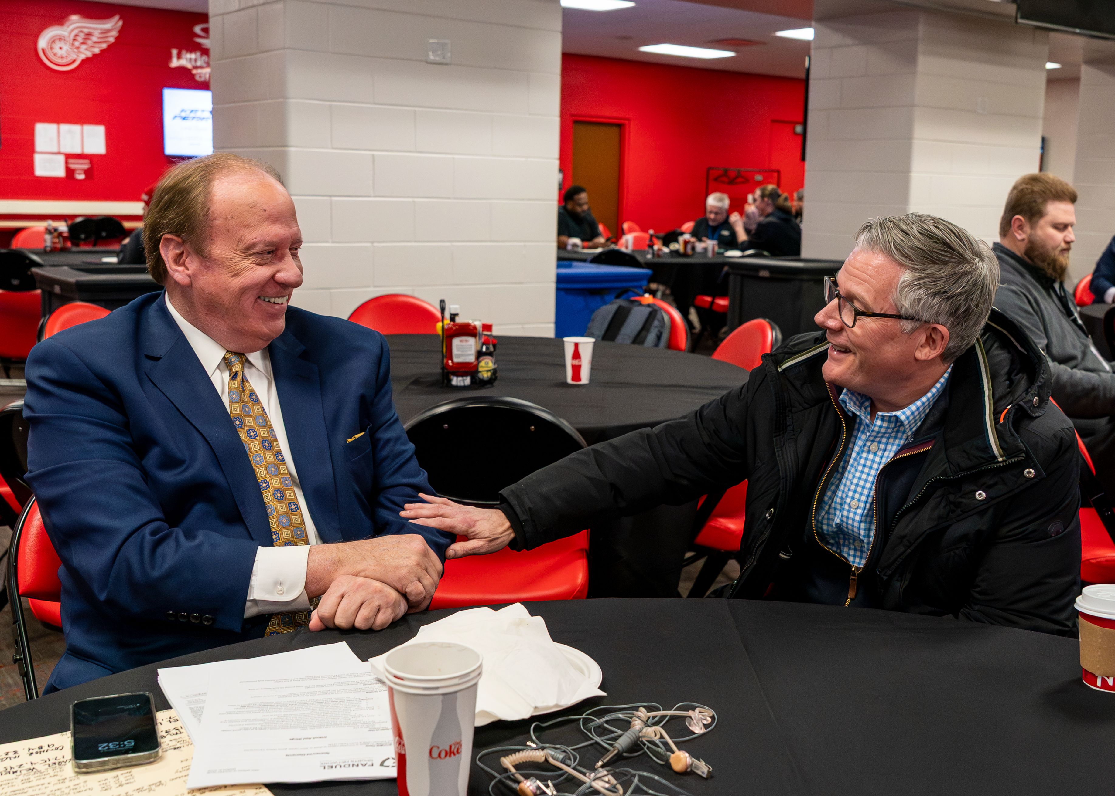 John Keating speaks with Utah Hockey Club broadcast director Paul Hemming before the game.