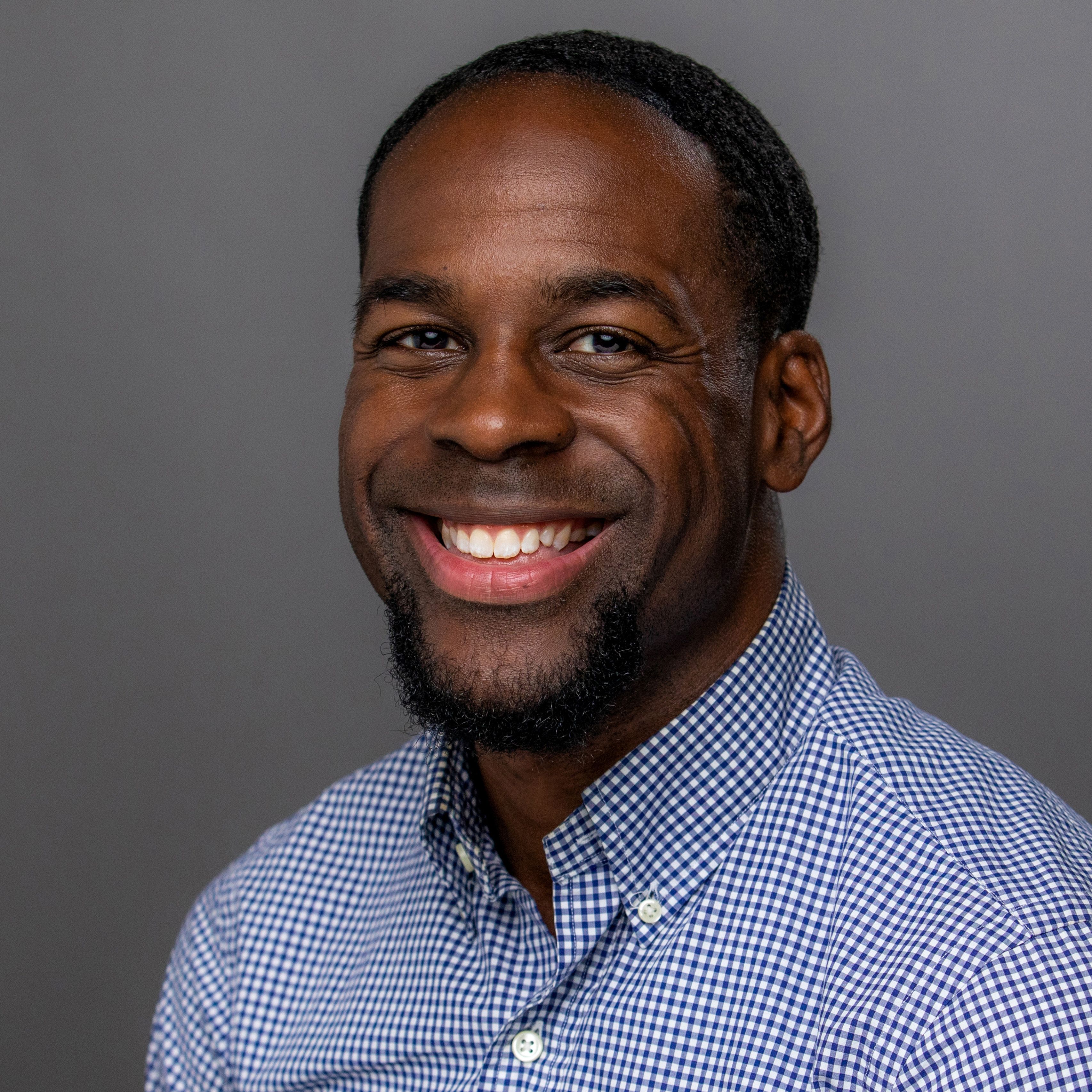 Corey Stamps in blue shirt, smiling