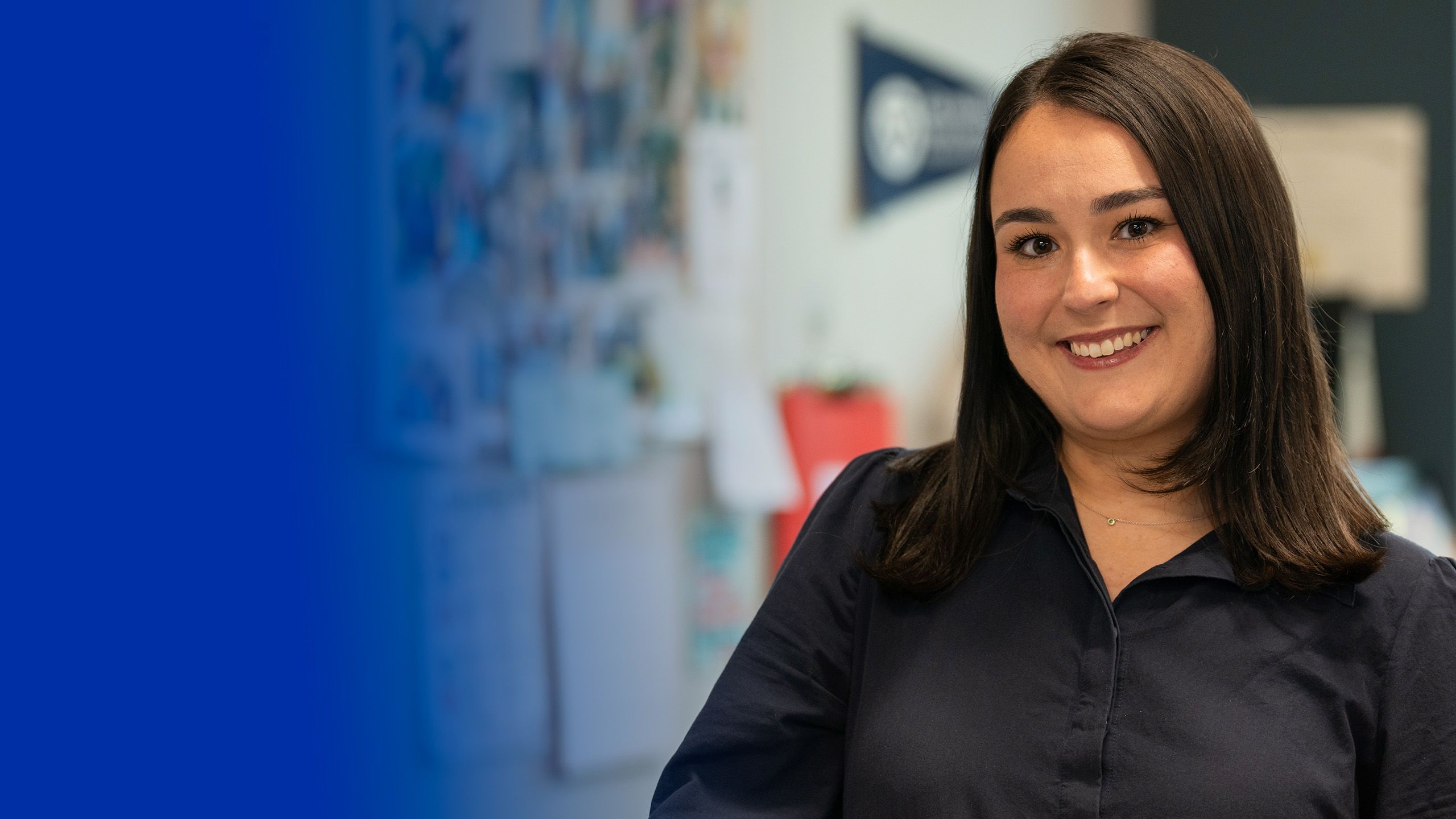 Gloria Masterton Hunter in dark shirt, seated